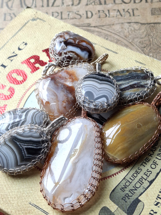 Handcrafted Wire-Wrapped & Polished Agate Pendants: Ancient Witness Stone